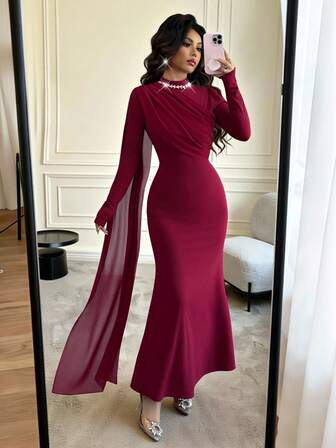 Rafferiza Elegant festklänning med pärldekorationer