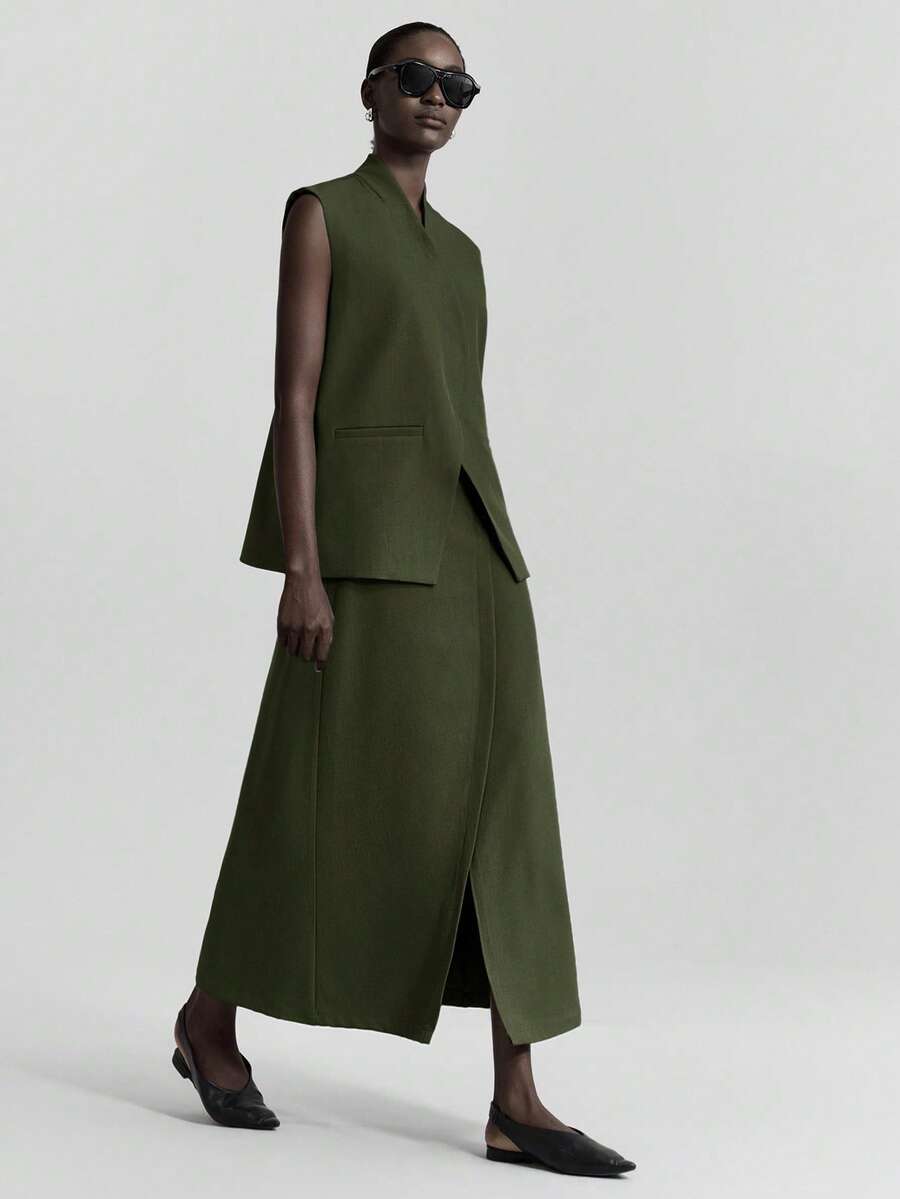 Ontre 2026春夏新款都市风抗皱深灰色西装套装，包括西装外套、马甲和裙子，适合办公室、商务休闲、派对等场合。