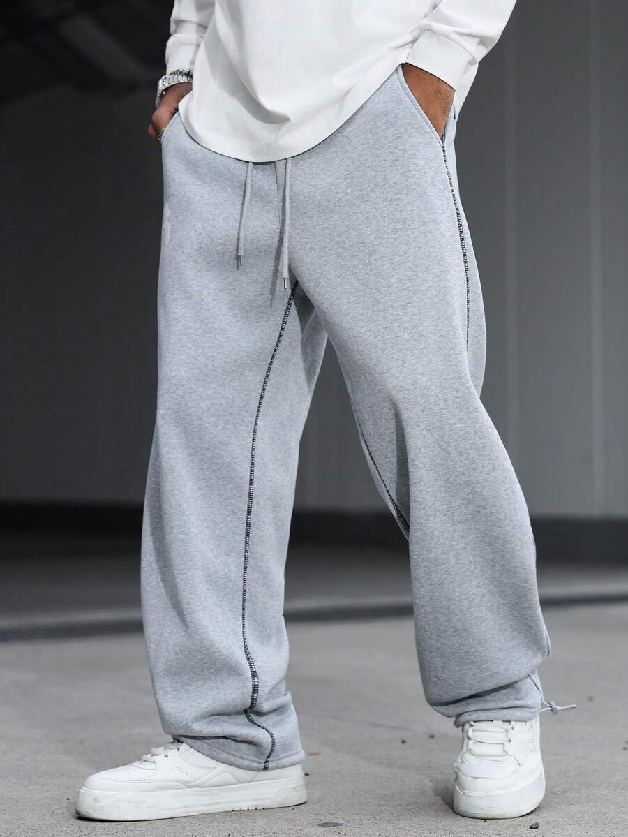 Manfinity Hypemode Quần nỉ nam in chữ, cạp chun, túi, ống rộng, dáng suông, kiểu dáng rộng rãi, quần nỉ thể thao nam, quần nỉ rộng ống cho nam màu xám. - Màu Xám nhạt - Xem 1