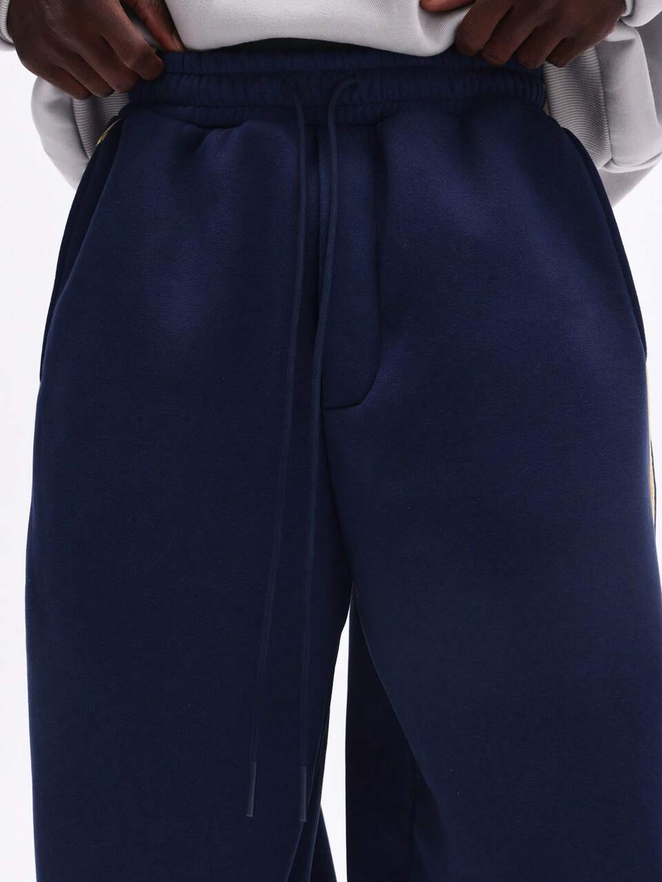 SUMWON Loose Fit Sweatpants With Vertical Brand Text Print And Side Stripe Details Casual Drawstring Waist Navy Pants With Elastic Cuffs