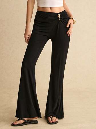 Poéselle Dambyxor med enfärgade metalldekorationer i midjan och veckade utsvängda ben