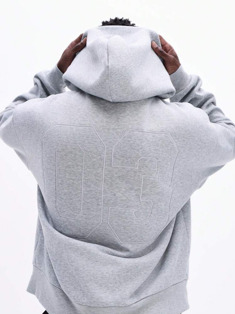 Sweat à capuche zippé coupe carrée avec écusson numéro