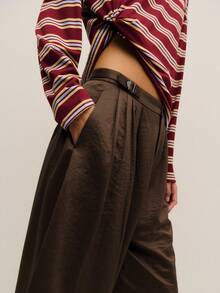 Nöista 女士纯色长裤，裤腿呈柔和的弧形，打造舒适现代的廓形，适合日常通勤、精致休闲穿着和百搭的春假装扮，是打造精致日常造型、轻松生日装扮和情人节装扮的完美之选。 - 咖啡棕 - 查看 5