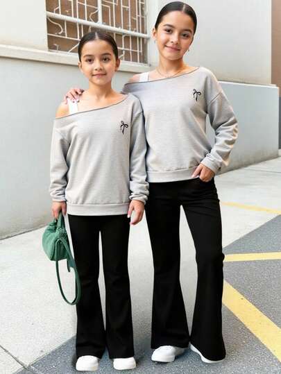 Sparklyn 少女两件套，采用露肩设计，精致蝴蝶结刺绣，浅灰色宽松长袖短帽衫搭配高腰黑色喇叭裤，厚度适中，舒适百搭，休闲时尚，适合校园穿着/购物探索/闺蜜聚会，春秋季日常穿着。