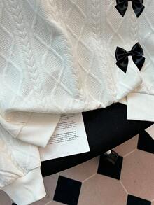 GlowEve Blusa feminina casual e moderna, cor sólida, texturizada, com gola redonda, ombros caídos, mangas compridas, modelagem solta, barra com fenda e detalhe de laço.