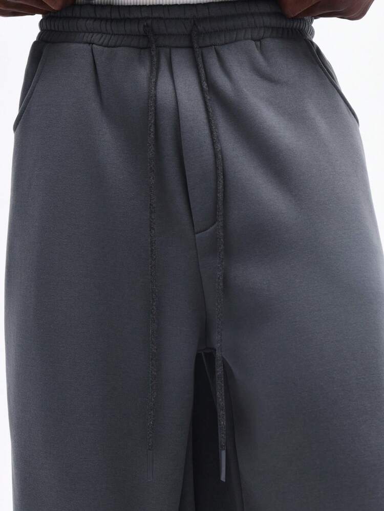 Pantalones deportivos con cordón ajustable y bolsillos laterales