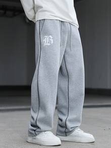 Manfinity Hypemode Quần nỉ nam in chữ, cạp chun, túi, ống rộng, dáng suông, kiểu dáng rộng rãi, quần nỉ thể thao nam, quần nỉ rộng ống cho nam màu xám. - Màu Xám nhạt - Xem 4