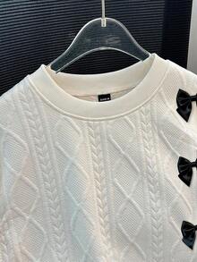 GlowEve Blusa feminina casual e moderna, cor sólida, texturizada, com gola redonda, ombros caídos, mangas compridas, modelagem solta, barra com fenda e detalhe de laço.