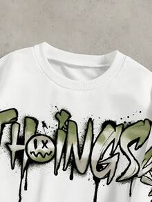 SHEIN Coolqubz 两件套时尚白色连帽衫搭配橄榄绿裤子，青少年男孩时尚穿搭。连帽衫采用绿色图案印花，面料柔软舒适，适合春秋季节，百搭校园休闲装 - 白色 - 查看 4