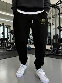 Manfinity Sport Corelite Pantalon de sport pour hommes avec cordon de serrage à la taille, imprimé lettres et crâne, avec poches - Noir - Voir 4