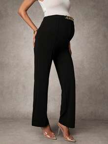 MaterniChic Pantaloni eleganti da donna in gravidanza con catena in metallo decorativa in vita, di colore unito - nero - Visualizzare 7