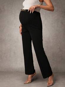 MaterniChic Pantaloni eleganti da donna in gravidanza con catena in metallo decorativa in vita, di colore unito - nero - Visualizzare 4