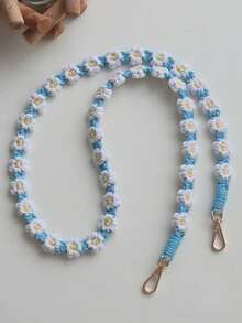 1个波西米亚风手工编织小雏菊斜挎包，配有手机挂绳、钥匙链，是送给母亲、家人、朋友的生日、节日礼物，也可作手机挂饰或手机链。