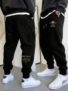 Manfinity Sport Corelite Pantalon de sport pour hommes avec cordon de serrage à la taille, imprimé lettres et crâne, avec poches - Noir - Voir 1