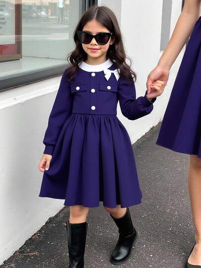 年轻女孩撞色圆领长袖蝴蝶结装饰纽扣设计可爱连衣裙