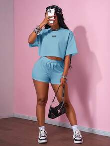 Slaydiva 2025 Bộ đồ thể thao giản dị phong cách đường phố cổ điển đại học 2 nhãn đen trang trí áo thun cổ tròn tay ngắn + quần short siêu ngắn bộ đồ thể thao áo len trắng siêu rộng bộ đồ hai mảnh dành cho nữ - Màu xanh lam - Xem 5