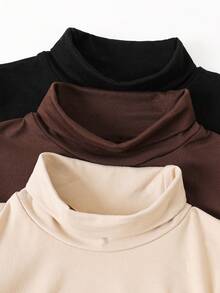 Emery Rose Kids 这款黑色高领褶皱纯色针织T恤，是年轻女孩日常休闲穿着和秋冬季校园穿搭的理想之选。新品上市，适合年轻女孩日常穿着，也适合上学、秋冬季节等场合。可搭配白色衬衫，打造返校季学院风。也适合圣诞节、女孩冬季服装、圣诞服装、派对服装、日常校园穿搭、生日服装、公主服装、母女/姐妹亲子装、万圣节等场合。 - 彩色 - 查看 3