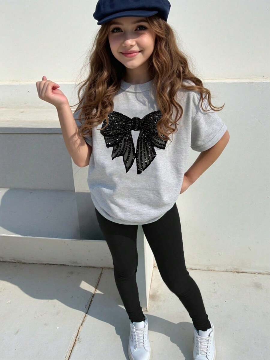 1 set T-shirt à manches courtes avec imprimé nœud à paillettes faux et leggings, style décontracté et confortable pour les jeunes filles. Convient pour les sorties, les sports et l'école, idéal pour l'été.