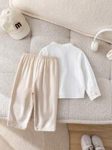 SHEIN 两件套男宝宝可爱都市绅士套装，白色衬衫搭配卡其色休闲裤，适合生日派对、晚宴、演出、婚礼、迎婴派对、洗礼和一周岁生日庆祝等场合，春夏秋冬四季皆宜。 - 卡其色 - 查看 2