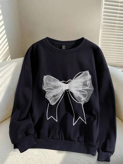 Modelyn Sudadera holgada de diseño minimalista de moda para mujer con cuello redondo, manga larga, estampado gráfico y decoración de lazo