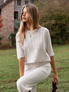 EURMUSE Two Pieces Ribbed Knit Set In Cream Featuring Short Sleeve Top With Waist Tie And Wide Leg Pants - White - View 2