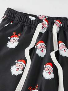 Manfinity Homme Quần đi biển ống đứng rộng rãi họa tiết Giáng sinh có dây rút eo dành cho nam - màu đen - Xem 8