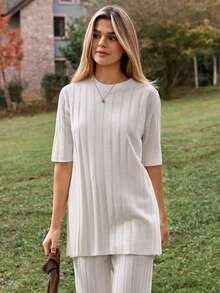 EURMUSE Two Pieces Ribbed Knit Set In Cream Featuring Short Sleeve Top With Waist Tie And Wide Leg Pants - White - View 6