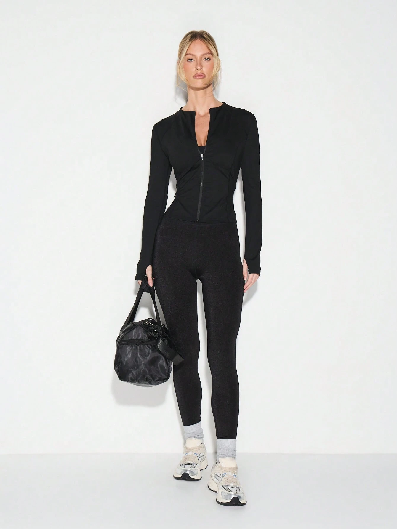 KIZN Top de manga larga con cremallera completa y cuello alto