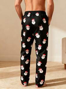 Manfinity Homme Quần đi biển ống đứng rộng rãi họa tiết Giáng sinh có dây rút eo dành cho nam - màu đen - Xem 2