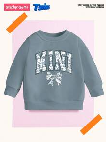 SHEIN Playful Pals Sweatshirt für Kleinkind Mädchen, lässige Mode mit kreativer Schleife, Blumen-Grafik, Slogan-Aufdruck, Rundhalsausschnitt, Herbstoutfit