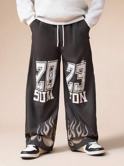  SUMWON Boys Grunge Style Wide Leg Pants With Flame Print And Varsity Numeric Graphics For Casual School Wear Vacation