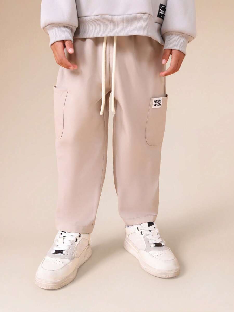 SUMWON Pantalones de chándal casuales con cordón y bolsillos laterales para niños, ajuste relajado y cómodo, para usar en otoño, invierno y días de descanso - Albaricoque - Ver 1