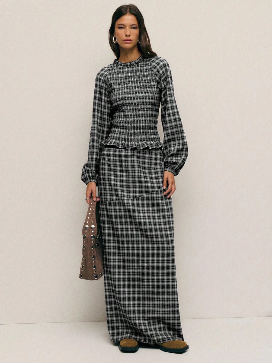 Nöista 两件套格子套装，包括一件长袖衬衫和一条带有荷叶边腰部的配套半身裙，打造优雅正式的廓形，非常适合女性春假穿搭、从办公室到晚宴的无缝过渡、派对的精致造型、生日聚会的女士服装叠穿搭配以及优雅的庆祝活动。 - 黑色 - 查看 1