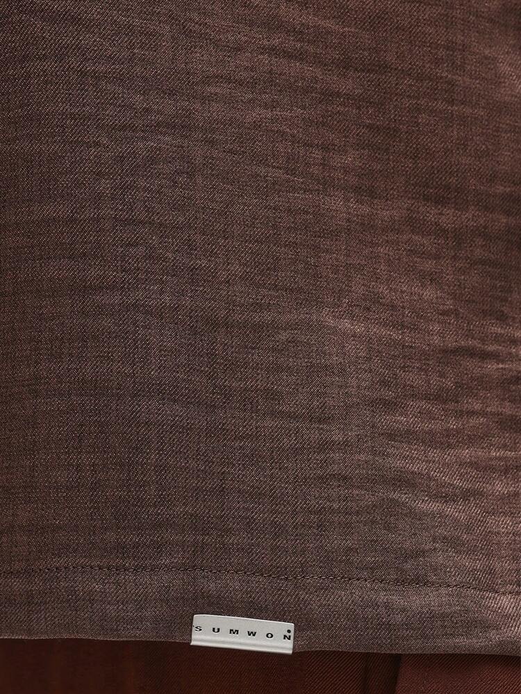 Chemise texturée à manches longues et coupe courte