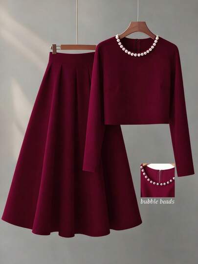 Franclia Conjunto elegante de blusa de manga larga con cuello redondo y decoración de perlas falsas, y falda evasé de unicolor para mujer