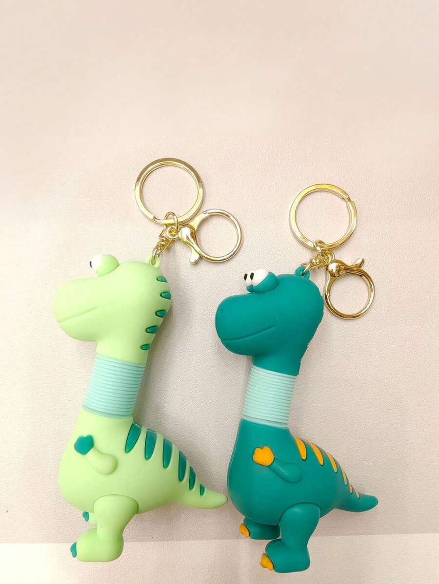 1 قطعة لعبة ديناصور بلاش قابلة للسحب بألوان عشوائية، سلسلة مفاتيح سيارة إبداعية، قلادة حقيبة ظهر للطلاب، هدية للأزواج - متعدد الألوان - مشاهدة 1