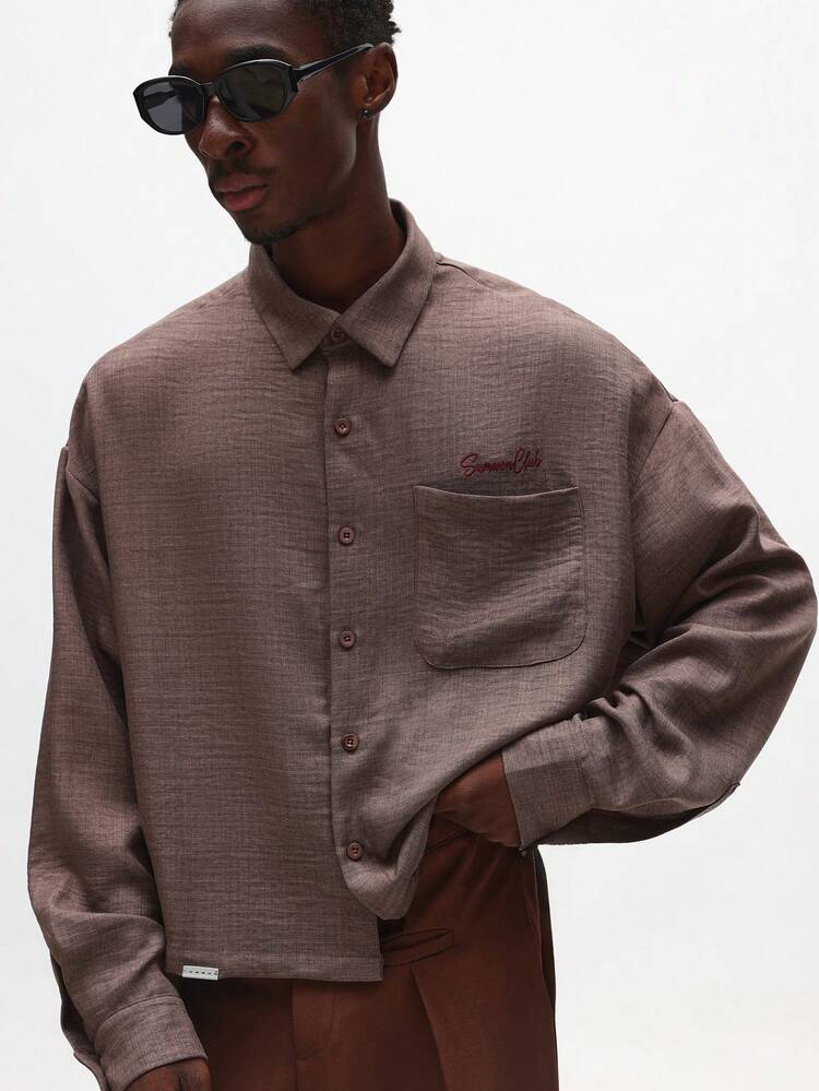 Chemise texturée à manches longues et coupe courte