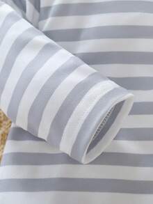 Bộ đồ ngủ 4 món cho bé sơ sinh - Áo liền quần có tất, khóa kéo phía trước, tay dài, cổ tròn, in hình gấu Koala, màu xám be sọc trung tính, phù hợp cho mọi mùa, quà tặng không thể thiếu cho phòng trẻ sơ sinh năm 2026. Thiết kế mềm mại và thoải mái. - Nhiều màu - Xem 4