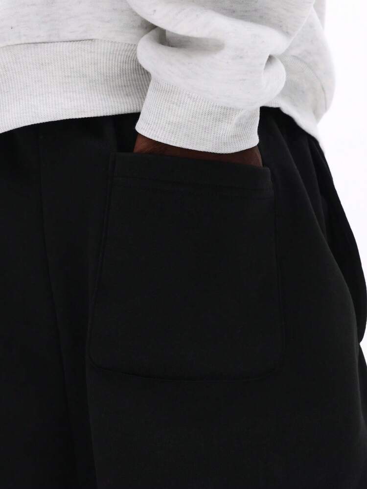 Pantalon de survêtement à entrejambe basse avec logo brodé