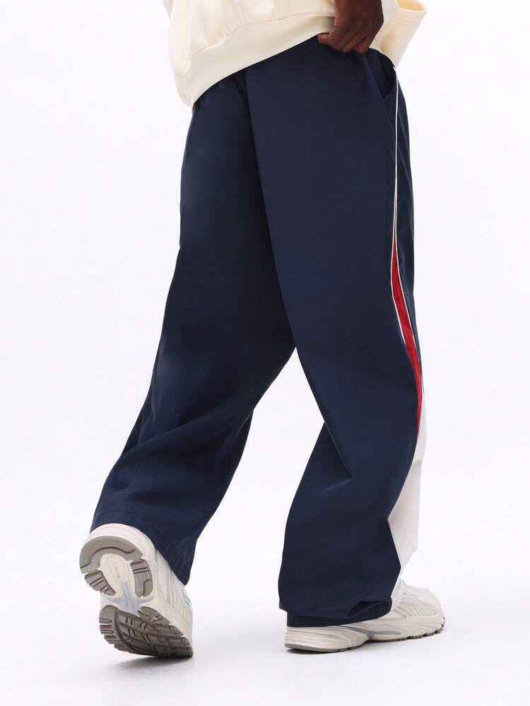 サイドストライプ付きネイビーナイロンパンツ