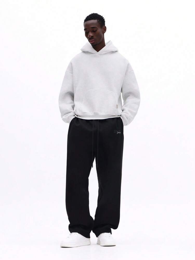 Pantalon de survêtement à entrejambe basse avec logo brodé