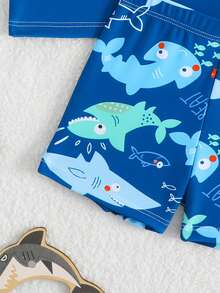 SHEIN 2pcs Baby/Toddler Boys' Swimsuit Set, Cute Cartoon Shark Print Colorblock Long Sleeve Knit Top And Swim Trunks, Separate Swimwear Outfit Boy Swim Set Baby Boy Rash Guard Boy Swimsuit Set Boy Long Sleeve Rash Guard Boy Swimsuit Set Long Sleeve Baby Boy Swim Set Baby Boy Swimsuit Long Sleeve Sea Animal Baby Clothes Beach Wear For Baby Boy Sea Horse Bathing Suit Toddler Baby Boy Shark Swimwear Boy Swimsuit Set Long Sleeve Baby Boy Beach Clothes - Blue - View 4