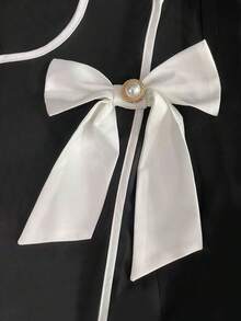 Franclia 大码女式优雅蝴蝶结袖口长袖衬衫，不对称下摆设计，百搭叠穿单品，适合办公和休闲场合穿着。 - 黑色 - 查看 3