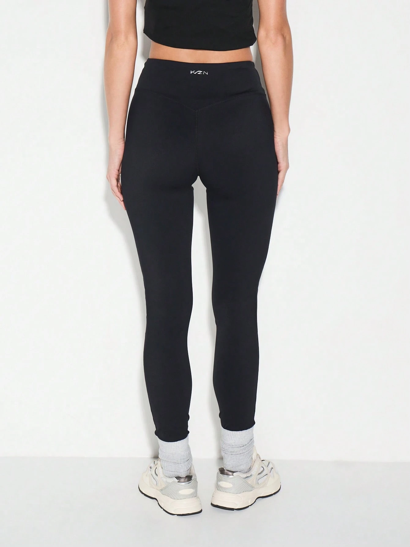 KIZN Calças legging de cintura alta com bolsos laterais