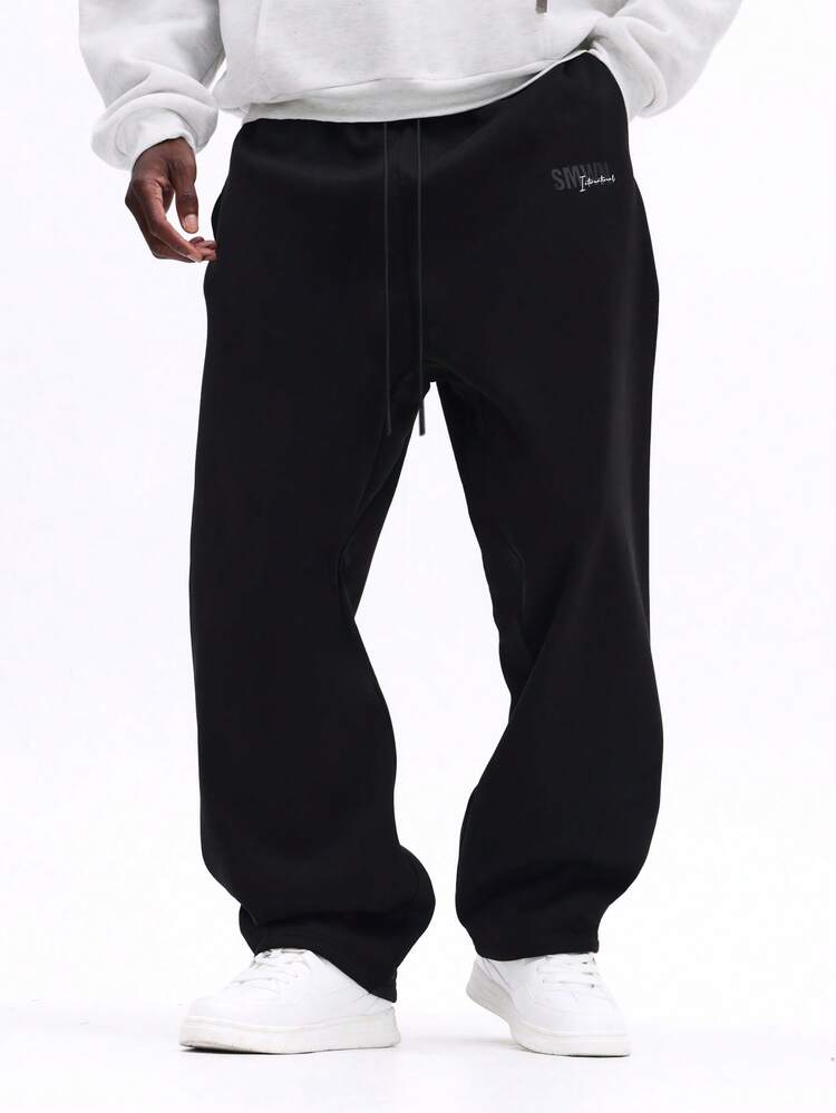 Pantalon de survêtement à entrejambe basse avec logo brodé