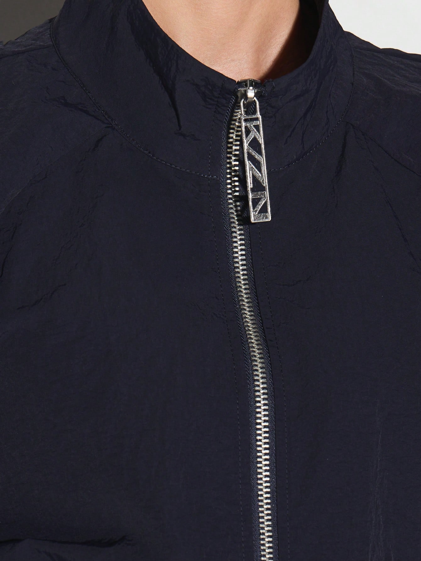 KIZN ドローストリング付きネイビージップアップスポーツジャケット