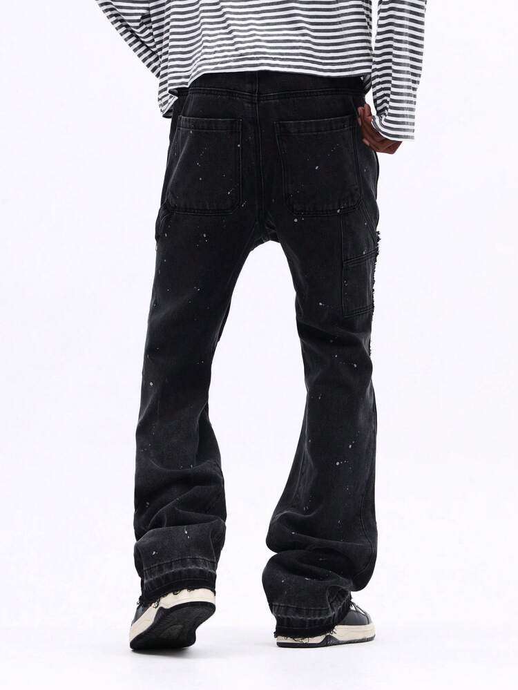 Vaqueros acampanados desgastados con salpicaduras de pintura