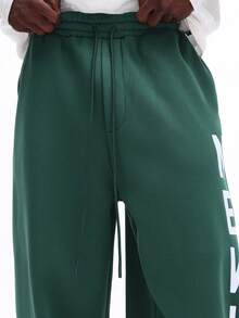 SUMWON Pantalon de jogging ample avec imprimé New York et graphiques sur les côtés des jambes. Style casual et confortable pour l'hiver. - Vert sapin - Voir 5