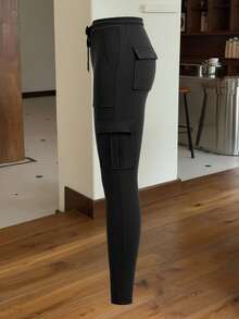 Muchica 黑色针织弹力女式紧身裤，女士春/秋休闲抽绳，口袋自然紧身七分黑色紧身女式裤子，休闲日常穿着