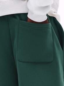 SUMWON Pantalon de jogging ample avec imprimé New York et graphiques sur les côtés des jambes. Style casual et confortable pour l'hiver. - Vert sapin - Voir 6